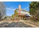 Two-story house with large deck, brick chimney, and landscaped yard at 1078 Meadow Brook Dr, Woodstock, GA 30188
