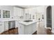 Modern kitchen with white cabinets and a large island at 1078 Meadow Brook Dr, Woodstock, GA 30188