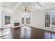 Sunlit living room with hardwood floors and fireplace at 1078 Meadow Brook Dr, Woodstock, GA 30188