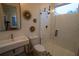 Modern bathroom with a walk-in shower and stylish gold fixtures at 1122 Nw Rice Nw St, Atlanta, GA 30318