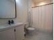 Clean bathroom with white vanity, toilet, and shower/tub combo at 1122 Nw Rice Nw St, Atlanta, GA 30318