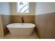 Elegant bathroom with freestanding tub and modern fixtures at 1122 Nw Rice Nw St, Atlanta, GA 30318