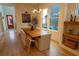 Dining room with hardwood floors, a farmhouse table, and a modern chandelier at 1122 Nw Rice Nw St, Atlanta, GA 30318
