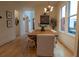 Dining room with hardwood floors, a farmhouse table, and a modern chandelier at 1122 Nw Rice Nw St, Atlanta, GA 30318