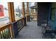 Spacious front porch with brick flooring and wooden railings at 1122 Nw Rice Nw St, Atlanta, GA 30318