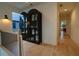 Light-filled hallway with hardwood floors and an elegant display cabinet at 1122 Nw Rice Nw St, Atlanta, GA 30318