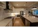 Modern kitchen with white cabinets, stainless steel appliances and large island with seating at 1122 Nw Rice Nw St, Atlanta, GA 30318