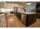 Modern kitchen with white cabinets, large island, and stainless steel appliances at 1122 Nw Rice Nw St, Atlanta, GA 30318