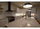 Modern kitchen with white cabinets, large island, and stainless steel appliances at 1122 Nw Rice Nw St, Atlanta, GA 30318