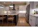 Modern kitchen with white cabinets, large island with seating, and stainless steel appliances at 1122 Nw Rice Nw St, Atlanta, GA 30318