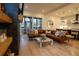 Living room with leather sectional sofa and sliding glass doors leading to a patio at 1122 Nw Rice Nw St, Atlanta, GA 30318