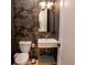 Stylish powder room with gold accents and a modern pedestal sink at 1122 Nw Rice Nw St, Atlanta, GA 30318