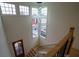 Elegant staircase with wooden railings and natural light at 1122 Nw Rice Nw St, Atlanta, GA 30318
