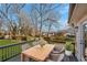 Relaxing deck with wooden dining table and chairs, overlooking backyard at 247 Fowler Ne Cir, Marietta, GA 30060