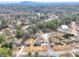 Aerial view of house and surrounding neighborhood at 879 Old Tucker Rd, Stone Mountain, GA 30087