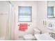 Simple bathroom with shower, toilet and vanity at 879 Old Tucker Rd, Stone Mountain, GA 30087