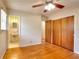 Bedroom with hardwood floors, ceiling fan and en-suite bathroom at 879 Old Tucker Rd, Stone Mountain, GA 30087