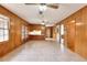 Bright dining room, featuring wood paneling and tile floors at 879 Old Tucker Rd, Stone Mountain, GA 30087