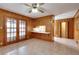 Dining area with wood paneling and access to the kitchen at 879 Old Tucker Rd, Stone Mountain, GA 30087