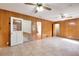 Open dining area with wood paneling and access to other rooms at 879 Old Tucker Rd, Stone Mountain, GA 30087
