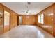 Spacious dining room with wood paneling and tile floors at 879 Old Tucker Rd, Stone Mountain, GA 30087