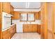 Kitchen with wood cabinets, tile floor and appliances at 879 Old Tucker Rd, Stone Mountain, GA 30087