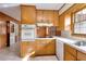 Kitchen with wood cabinets, tile floor and appliances at 879 Old Tucker Rd, Stone Mountain, GA 30087