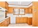 Kitchen with wood cabinets, tile floor and appliances at 879 Old Tucker Rd, Stone Mountain, GA 30087