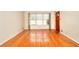 Spacious living room with hardwood floors and large windows at 879 Old Tucker Rd, Stone Mountain, GA 30087