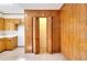 Walk-in pantry with wood paneling and bi-fold doors at 879 Old Tucker Rd, Stone Mountain, GA 30087