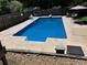 Refreshing blue inground pool with patio and seating at 879 Old Tucker Rd, Stone Mountain, GA 30087