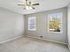 Well-lit bedroom with neutral walls and carpet at 1058 Hickory Rd, Canton, GA 30115