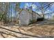 Gray house side view, showing garage and driveway at 1058 Hickory Rd, Canton, GA 30115