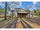 Ranch house with a large deck and wooded backyard at 1058 Hickory Rd, Canton, GA 30115