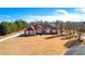 Brick house with a large yard and driveway, seen from above at 160 Thistlewood Ln, Fayetteville, GA 30214