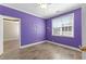 Purple bedroom with large window and tile floors at 160 Thistlewood Ln, Fayetteville, GA 30214