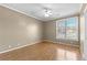 Spacious bedroom with hardwood floors and a large window at 160 Thistlewood Ln, Fayetteville, GA 30214