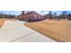 Three-car garage with long driveway at 160 Thistlewood Ln, Fayetteville, GA 30214