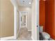 Hallway with view into additional rooms and powder room at 160 Thistlewood Ln, Fayetteville, GA 30214