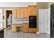 Kitchen boasts ample cabinetry and built-in desk area at 160 Thistlewood Ln, Fayetteville, GA 30214