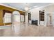 Open living room with fireplace and built-in shelving at 160 Thistlewood Ln, Fayetteville, GA 30214