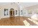 Sunroom with hardwood floors and multiple windows at 160 Thistlewood Ln, Fayetteville, GA 30214