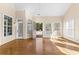 Bright sunroom with hardwood floors and access to backyard at 160 Thistlewood Ln, Fayetteville, GA 30214