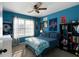 Blue bedroom with double bed and shelving at 18 Ponders Se Rd, Cartersville, GA 30121