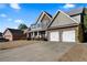 Two-story home with stone and siding exterior, two-car garage at 18 Ponders Se Rd, Cartersville, GA 30121