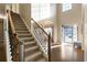 Elegant staircase with wrought iron railing and carpeted steps at 18 Ponders Se Rd, Cartersville, GA 30121