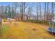 Large backyard with trampoline, shed, and plenty of space for recreation at 2767 Tony Dr, Lawrenceville, GA 30044