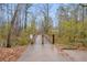 Wooden footbridge over a tranquil waterway in a wooded area at 2767 Tony Dr, Lawrenceville, GA 30044