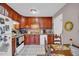 Cozy kitchen features wood cabinets, and a white refrigerator at 2767 Tony Dr, Lawrenceville, GA 30044