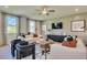 Living room with white sofas, wood coffee table, and built-in media cabinet at 410 Newland Way, Acworth, GA 30102